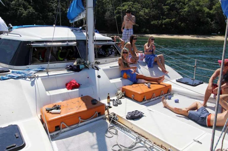 sydney catamaran cruises boys and girls relaxing in boat
